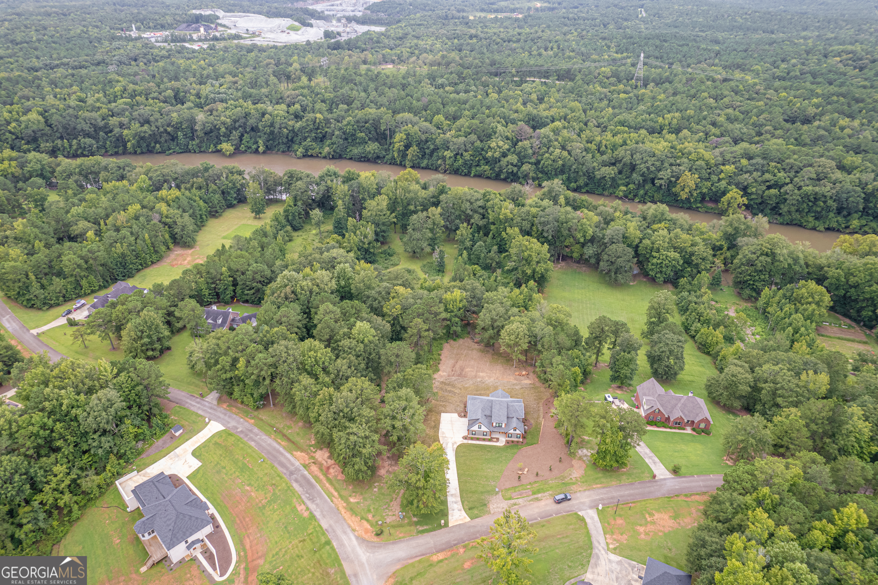 303 Tumbling Shoals Court Gray, GA 31032 - Photo 81 of 86 an aerial view of a house with a yard and lake view