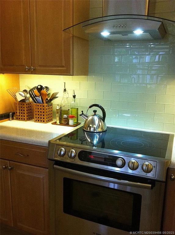 15 Miramar Road Stuart, FL 34996 - Photo 11 of 41 a stove top oven sitting inside of a kitchen