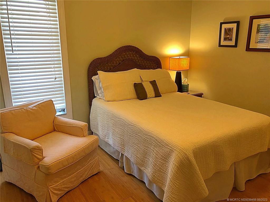 15 Miramar Road Stuart, FL 34996 - Photo 22 of 41 a bedroom with a bed and painting on the wall