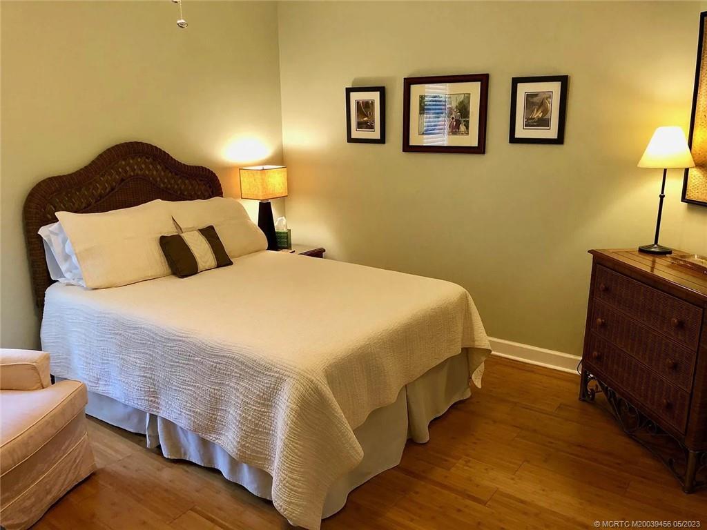 15 Miramar Road Stuart, FL 34996 - Photo 23 of 41 a bed room with a bed and a night stand