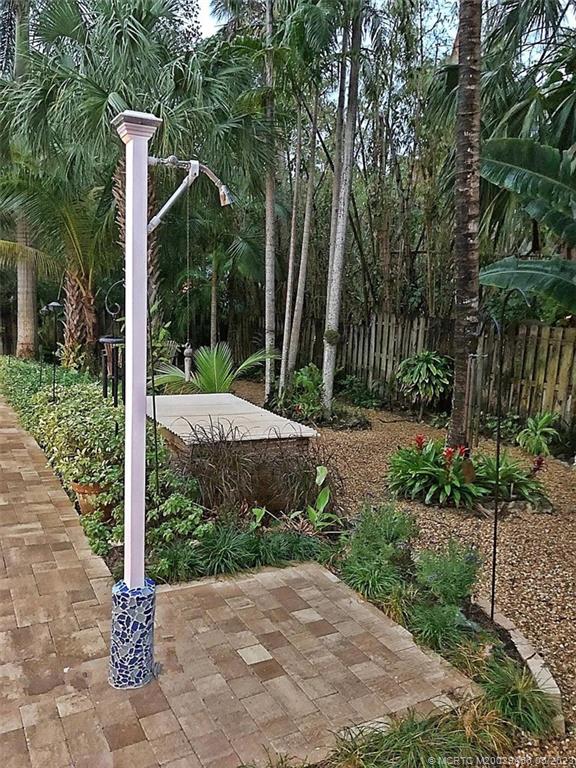 15 Miramar Road Stuart, FL 34996 - Photo 31 of 41 a view of a garden with large trees and plants