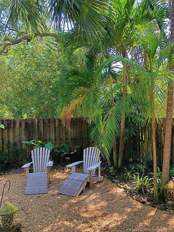 15 Miramar Road Stuart, FL 34996 - Photo 37 of 41 a view of backyard with plants and outdoor seating