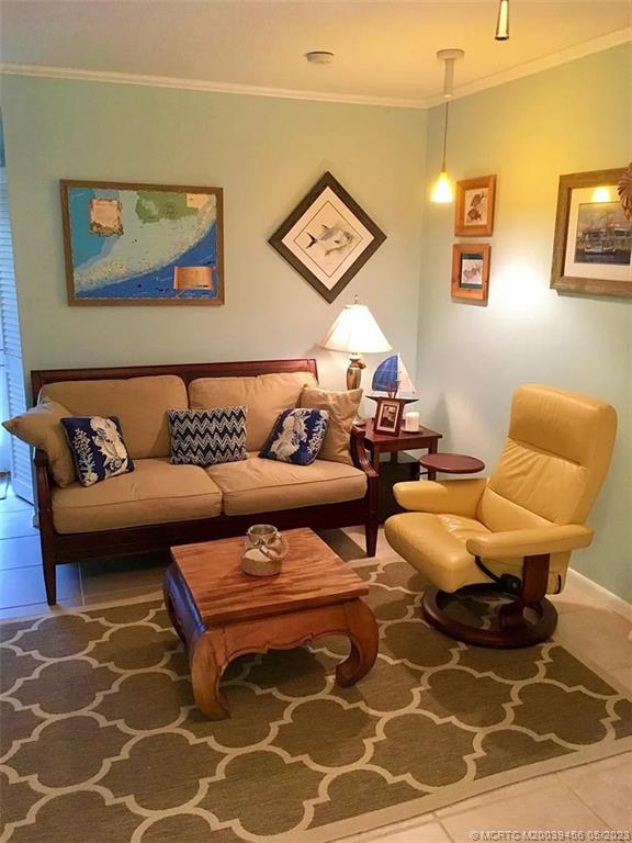 15 Miramar Road Stuart, FL 34996 - Photo 5 of 41 a living room with furniture and painting on the wall