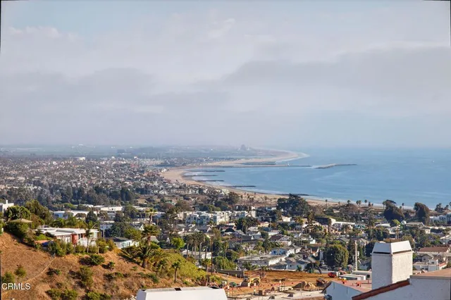 a utility room with cabinets washer and dryer