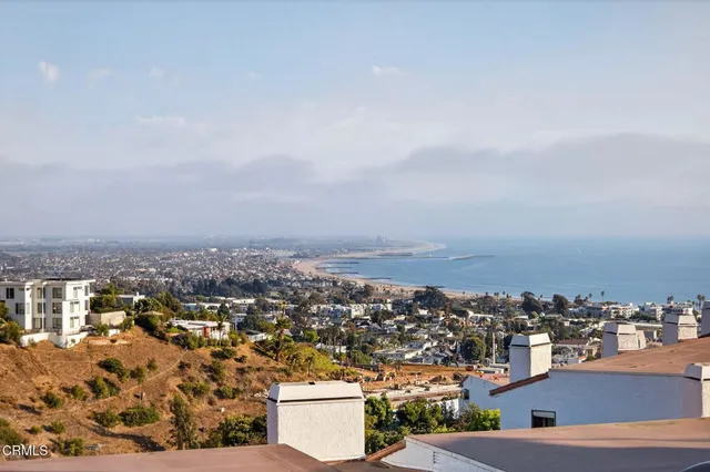 a kitchen with granite countertop cabinets stainless steel appliances and wooden floor