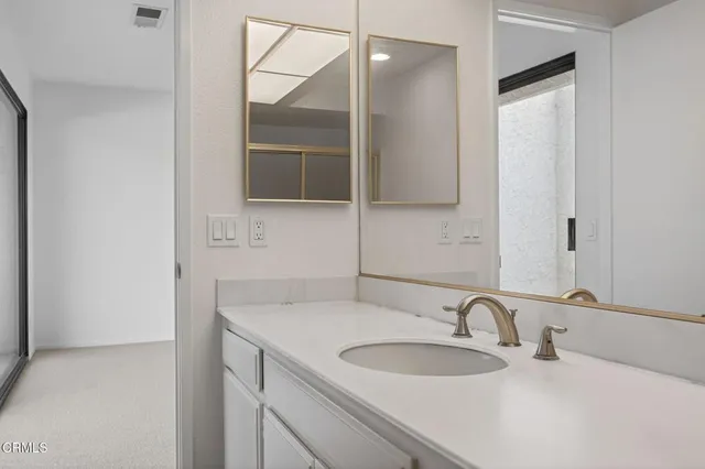 a view of an empty room with a sliding door