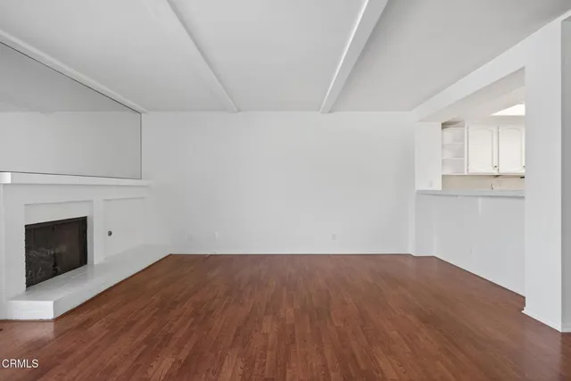 a view of an empty room with glass door