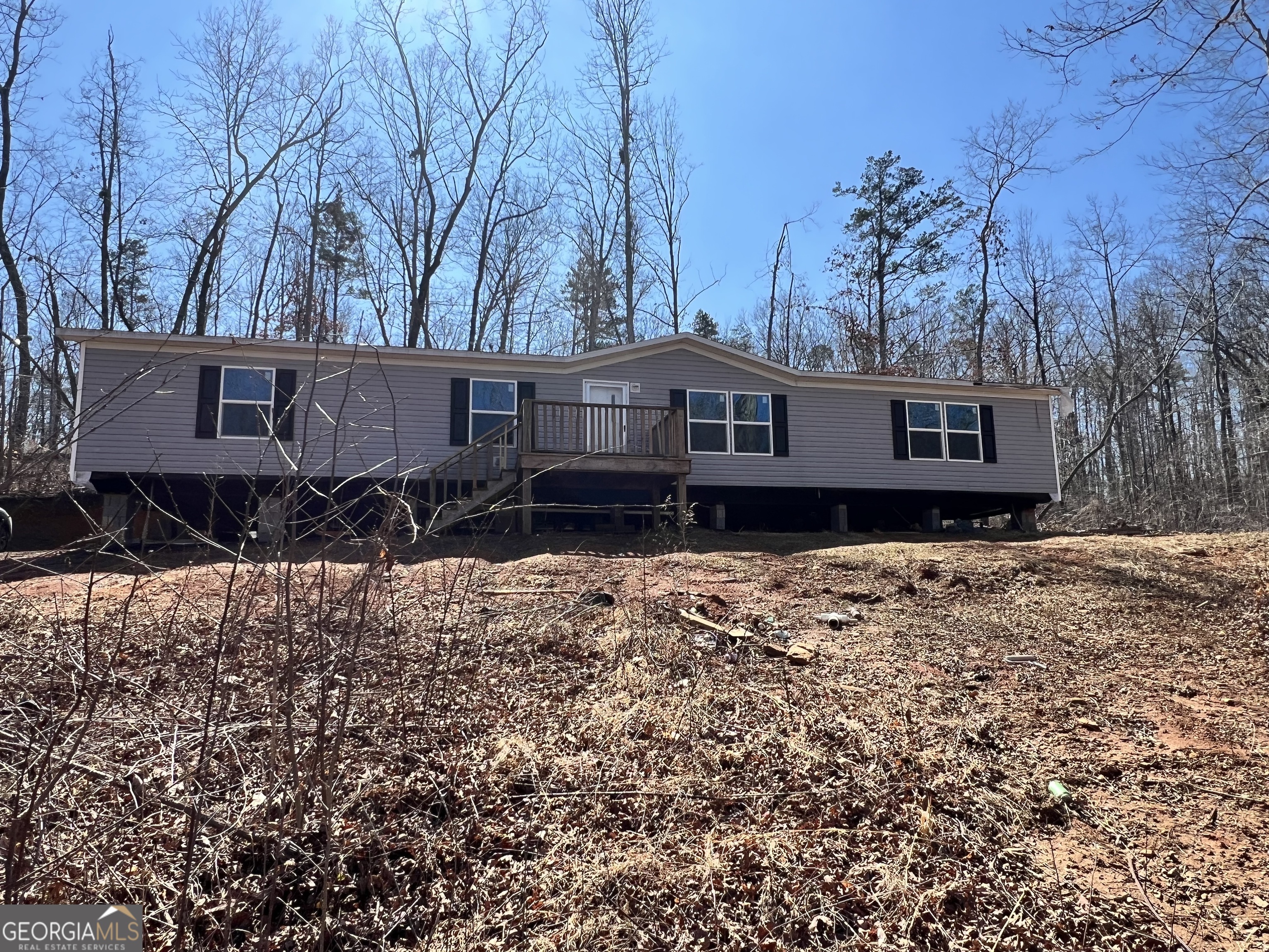a house view with a backyard space