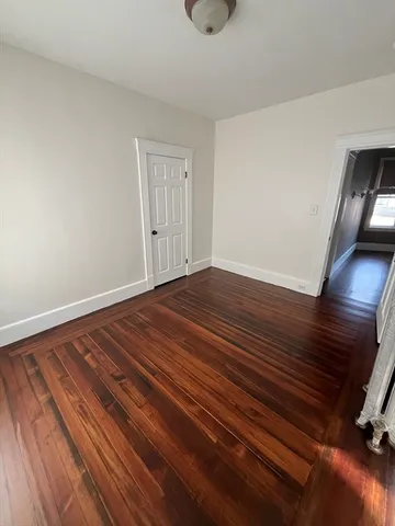 a view of a kitchen from the hallway
