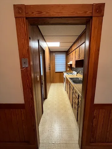 a view of a kitchen from the hallway