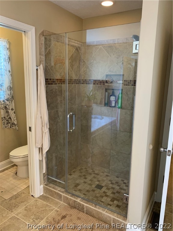 27 Germantown Road Cameron, NC 28326 - Photo 23 of 39 a bathroom with a glass door shower