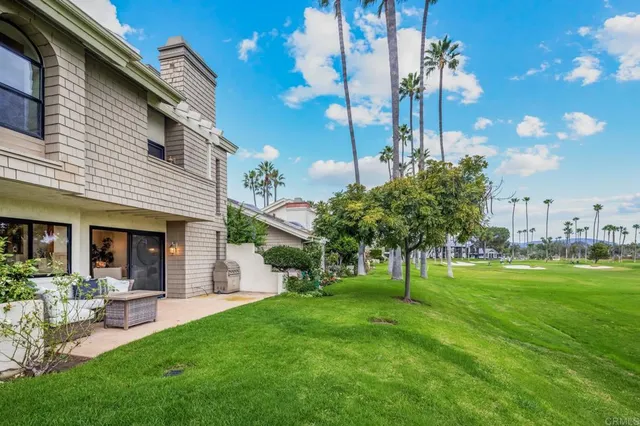 a view of a house with a backyard