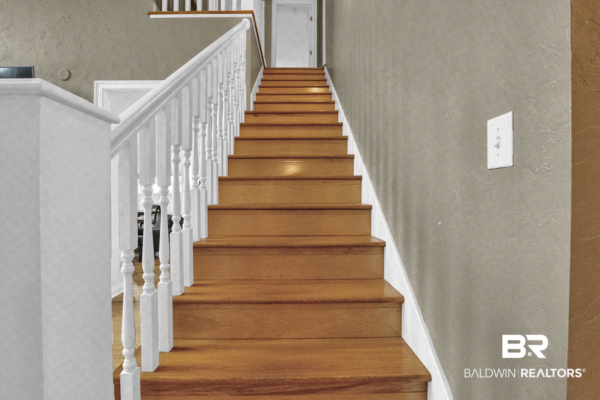 9002 Parliament Circle Daphne, AL 36526 - Photo 46 of 73 Staircase with hardwood / wood-style flooring