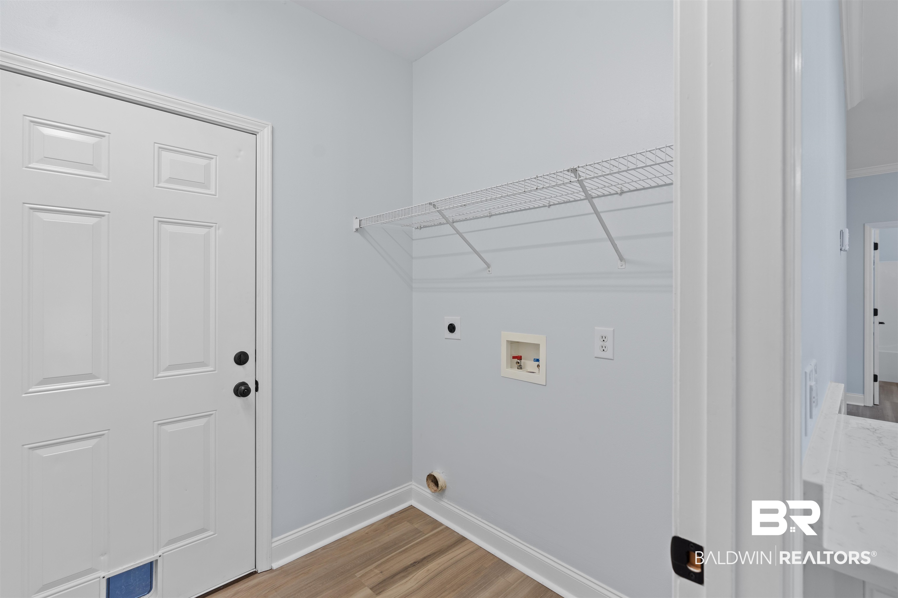 14947 Silveroaks Loop Silverhill, AL 36576 - Photo 24 of 24 Laundry room featuring light wood-type flooring, hookup for a washing machine, and hookup for an electric dryer
