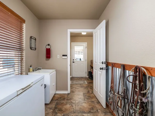 a bathroom with a sink a mirror and a shower