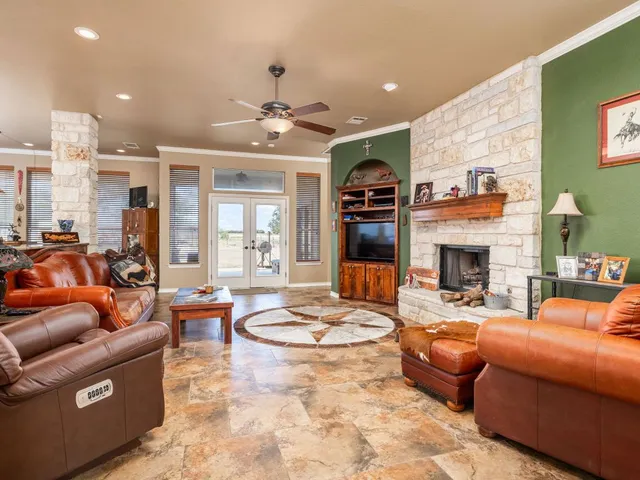 a outdoor living space with furniture and a fireplace