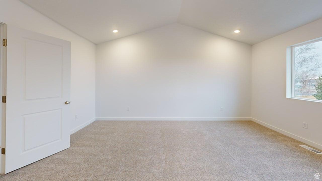 777 Pheasantbrook Drive, Unit 2B Centerville, UT 84014 - Photo 20 of 42 Spacious room featuring vaulted ceilings, light neutral carpeting, recessed lighting, and a single window with white trim