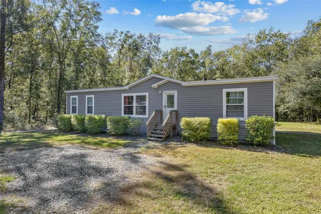a kitchen with stainless steel appliances a refrigerator and a stove top oven