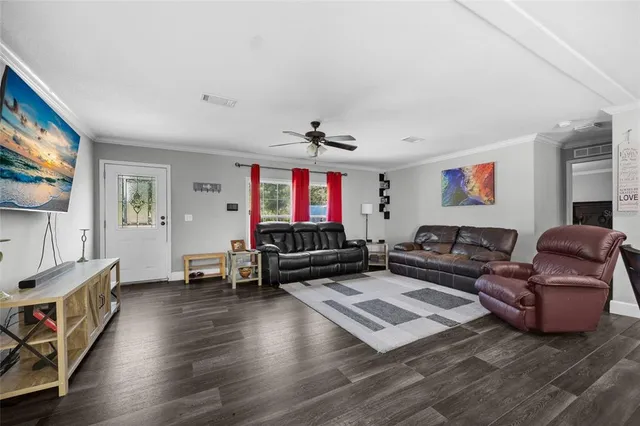 a kitchen that has a lot of cabinets a sink and appliances