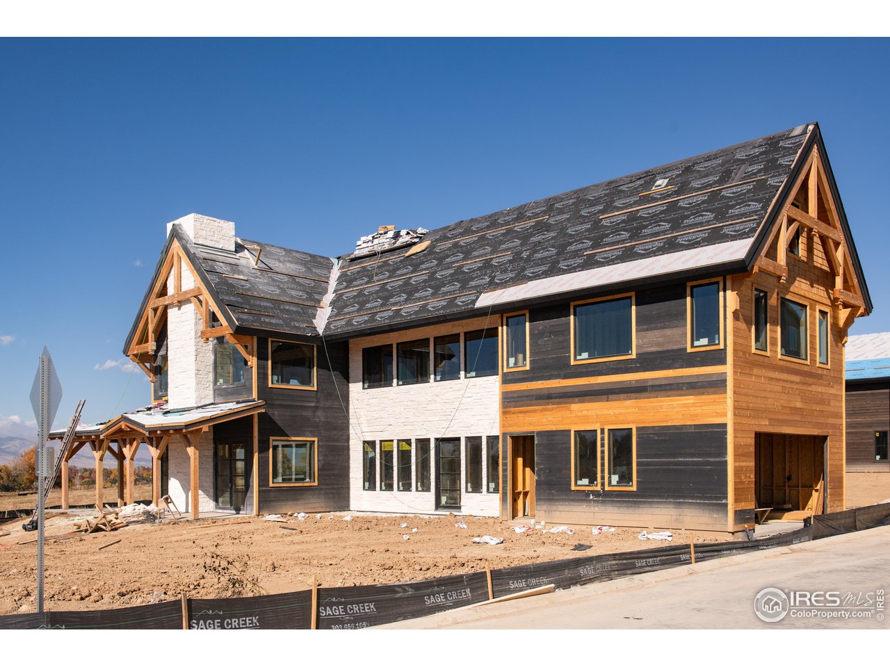 909 Latigo Loop Lafayette, CO 80026 - Photo 2 of 16 a black and white photo of a building