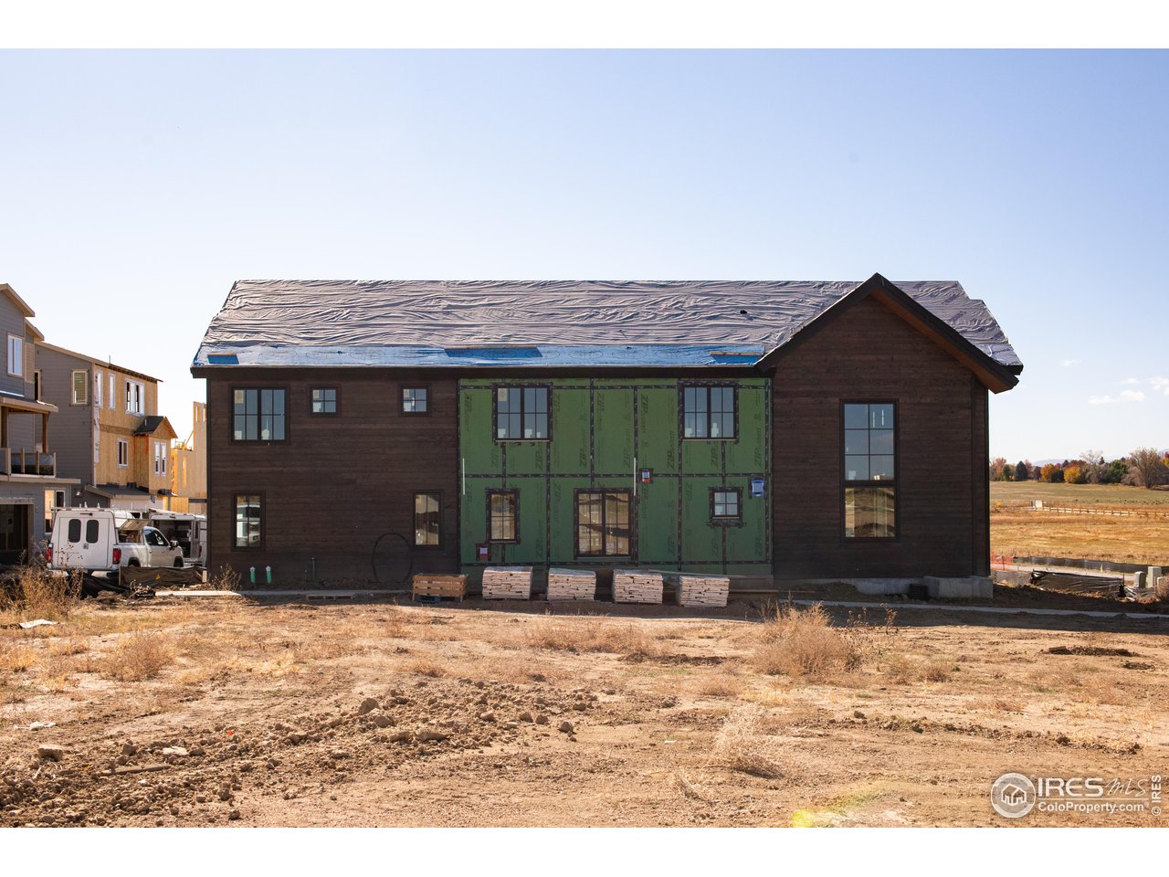 909 Latigo Loop Lafayette, CO 80026 - Photo 8 of 16 a front view of a house with a yard