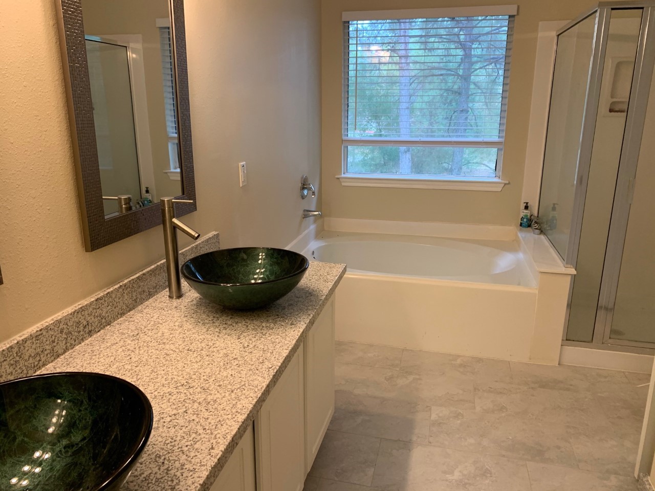 42 Blue Creek Place Spring, TX 77382 - Photo 12 of 18 a bathroom with a granite countertop bathtub and shower