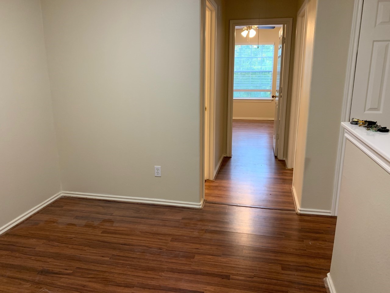 42 Blue Creek Place Spring, TX 77382 - Photo 14 of 18 a view of a room with wooden floor and a window