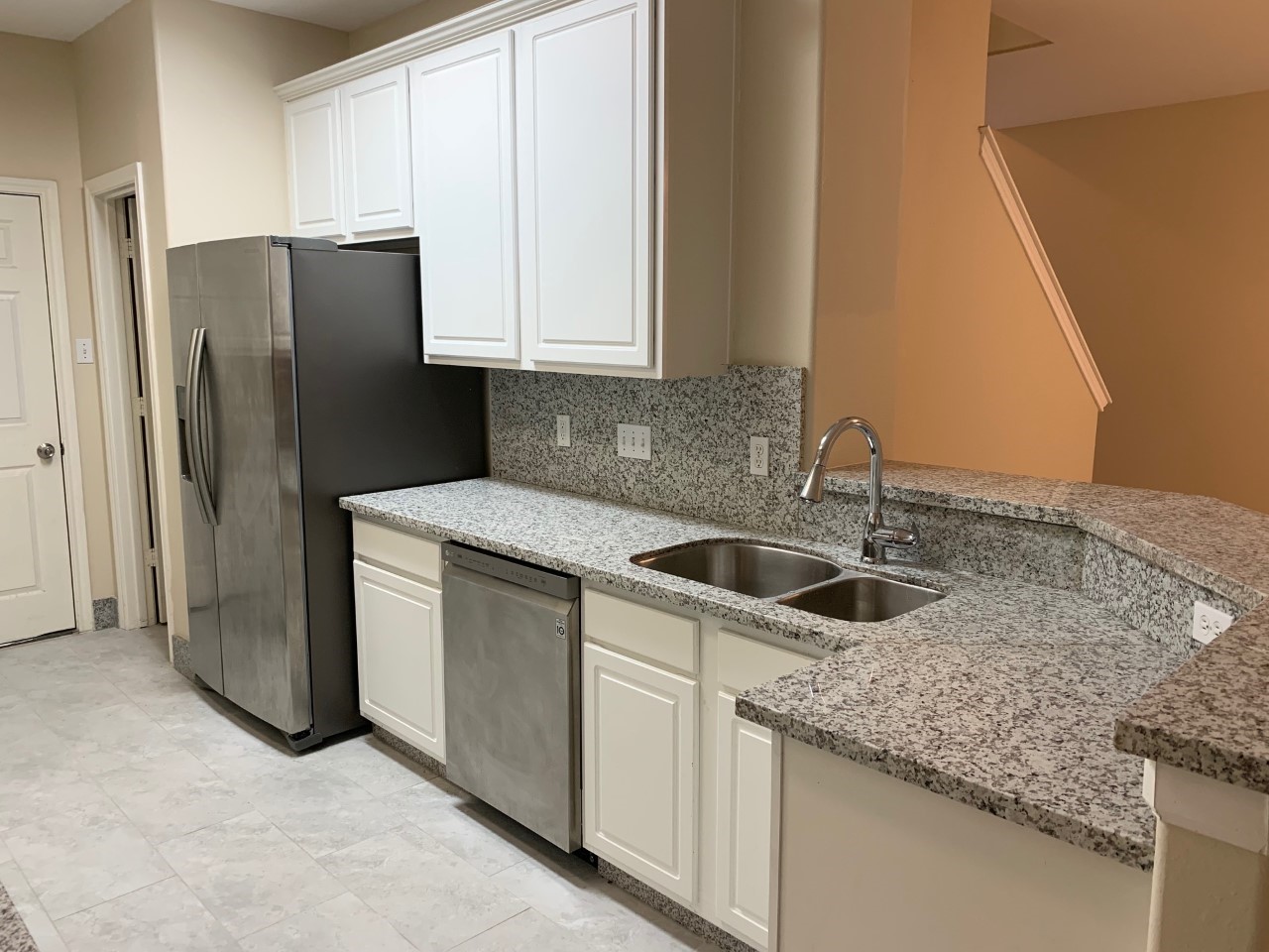42 Blue Creek Place Spring, TX 77382 - Photo 2 of 18 a kitchen with stainless steel appliances granite countertop white cabinets and refrigerator
