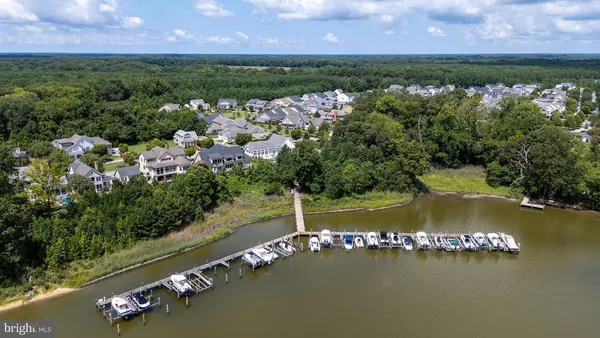 an aerial view of a house with a lake view