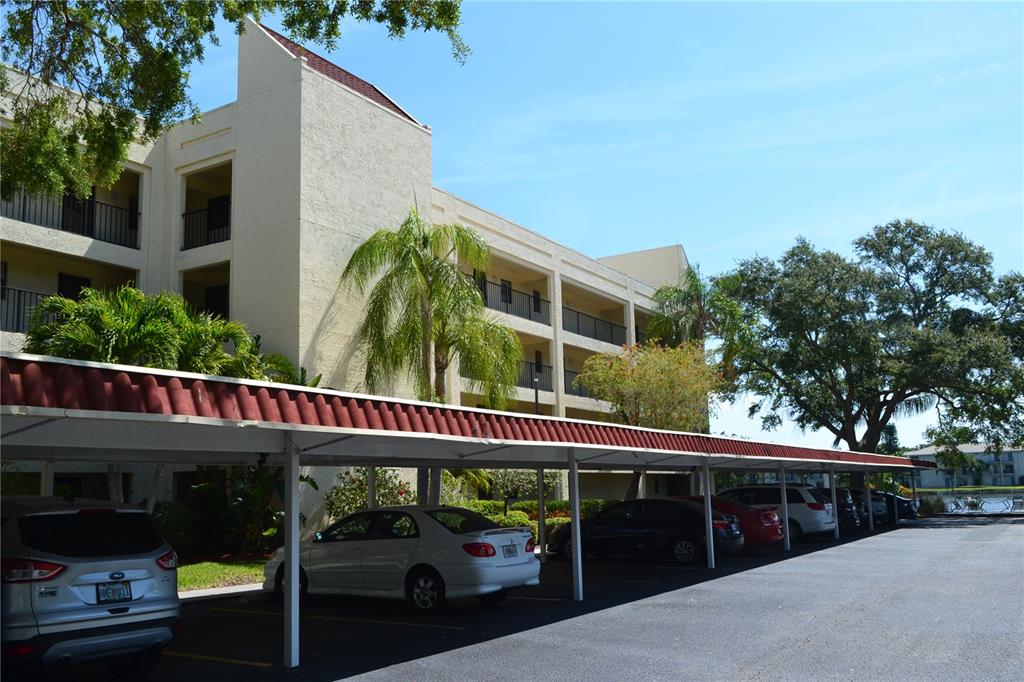 11485 Oakhurst Road, Unit A406 Largo, FL 33774 - Photo 1 of 1 Unit is the top floor at the end - covered parking right in front of building near the elevator