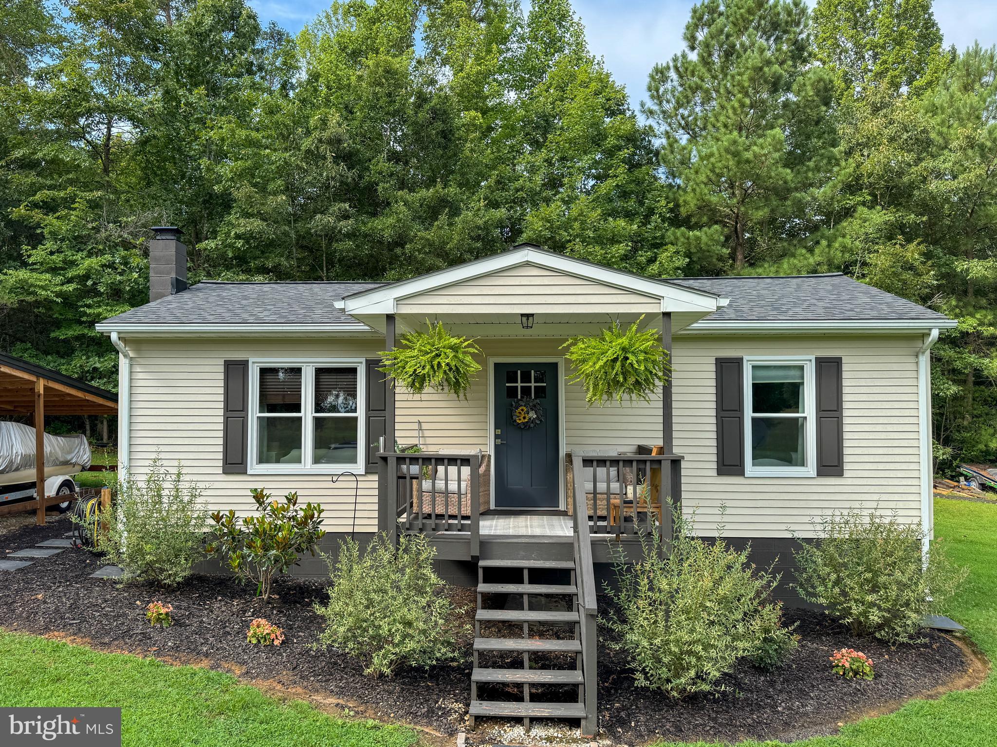 3843 Buckner Road Mineral, VA 23117 - Photo 1 of 26 a front view of a house with garden