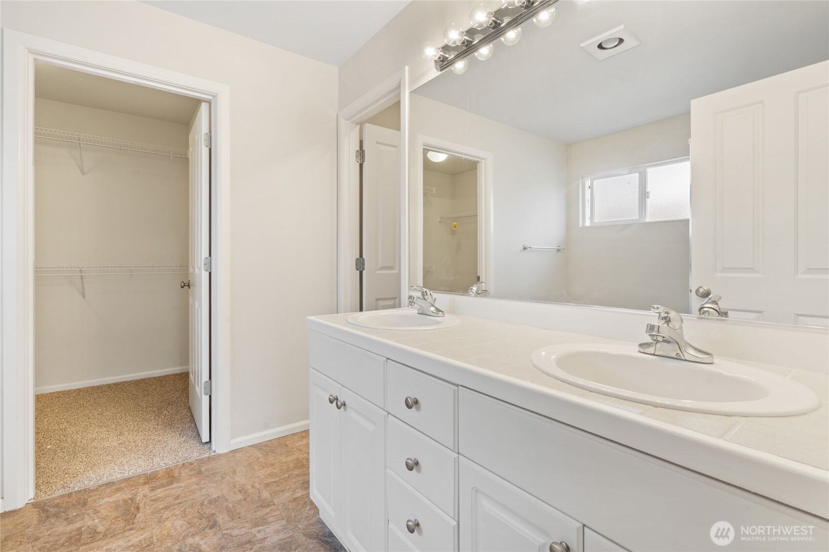 16919 165th Place Southeast Renton, WA 98058 - Photo 18 of 29 a bathroom with a sink and a mirror