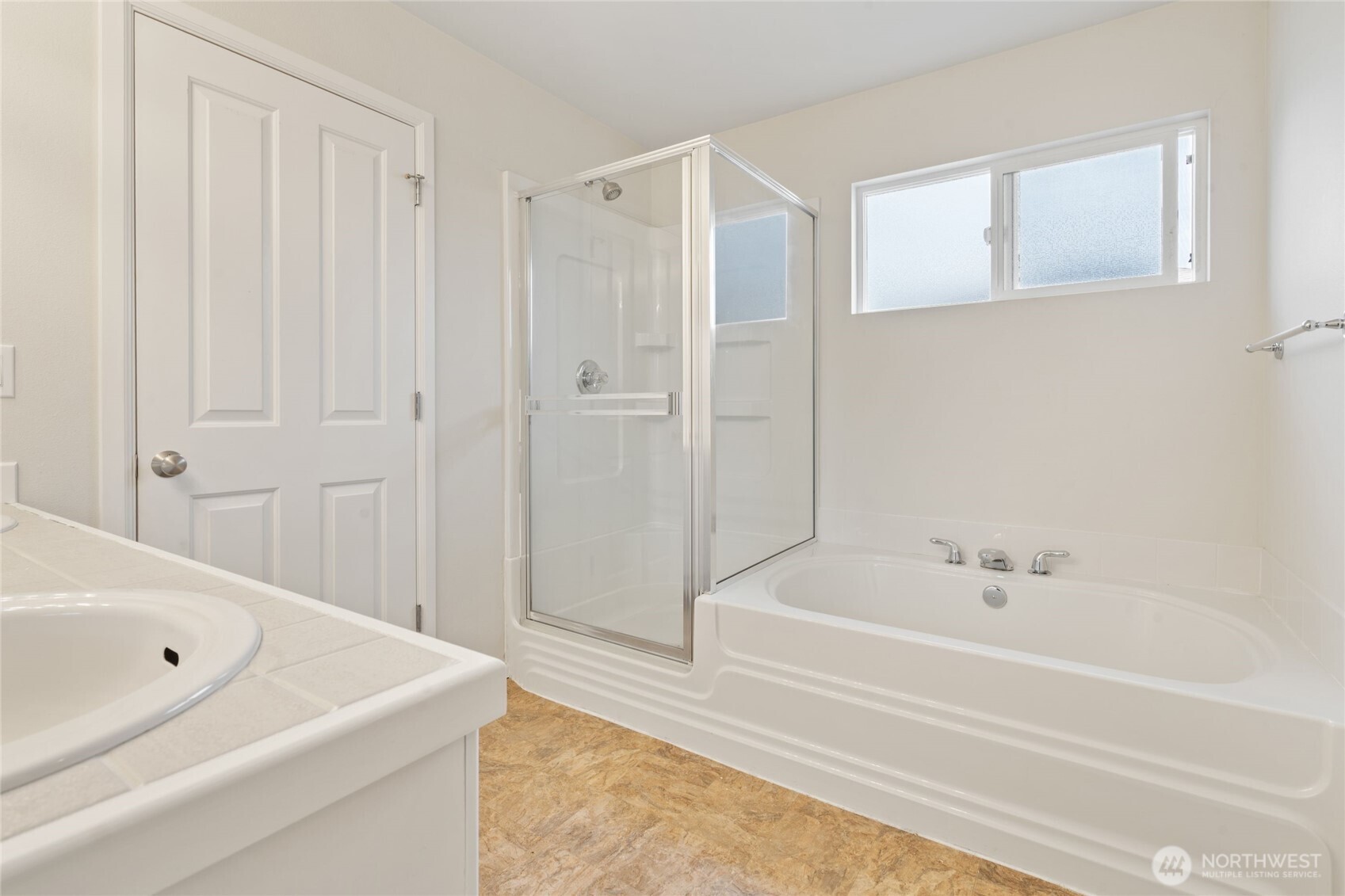 16919 165th Place Southeast Renton, WA 98058 - Photo 19 of 29 a bathroom with a bathtub and a shower