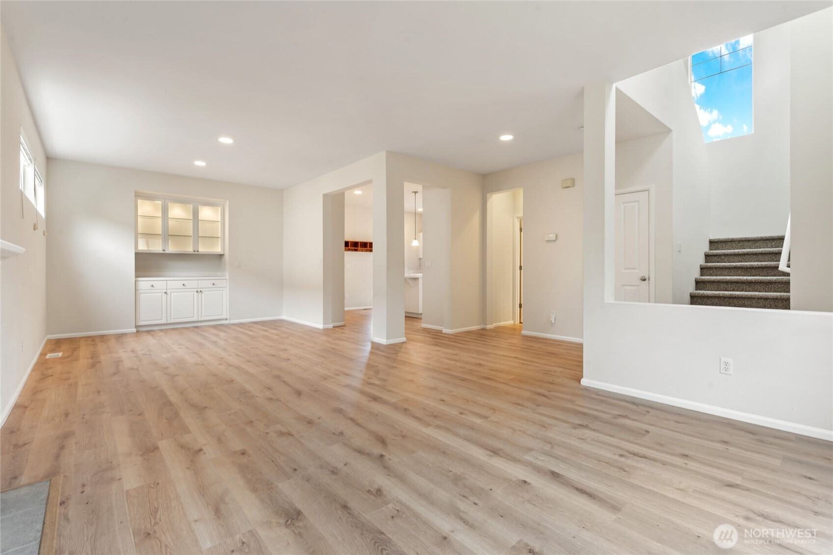 16919 165th Place Southeast Renton, WA 98058 - Photo 7 of 29 a view of empty room with wooden floor and window