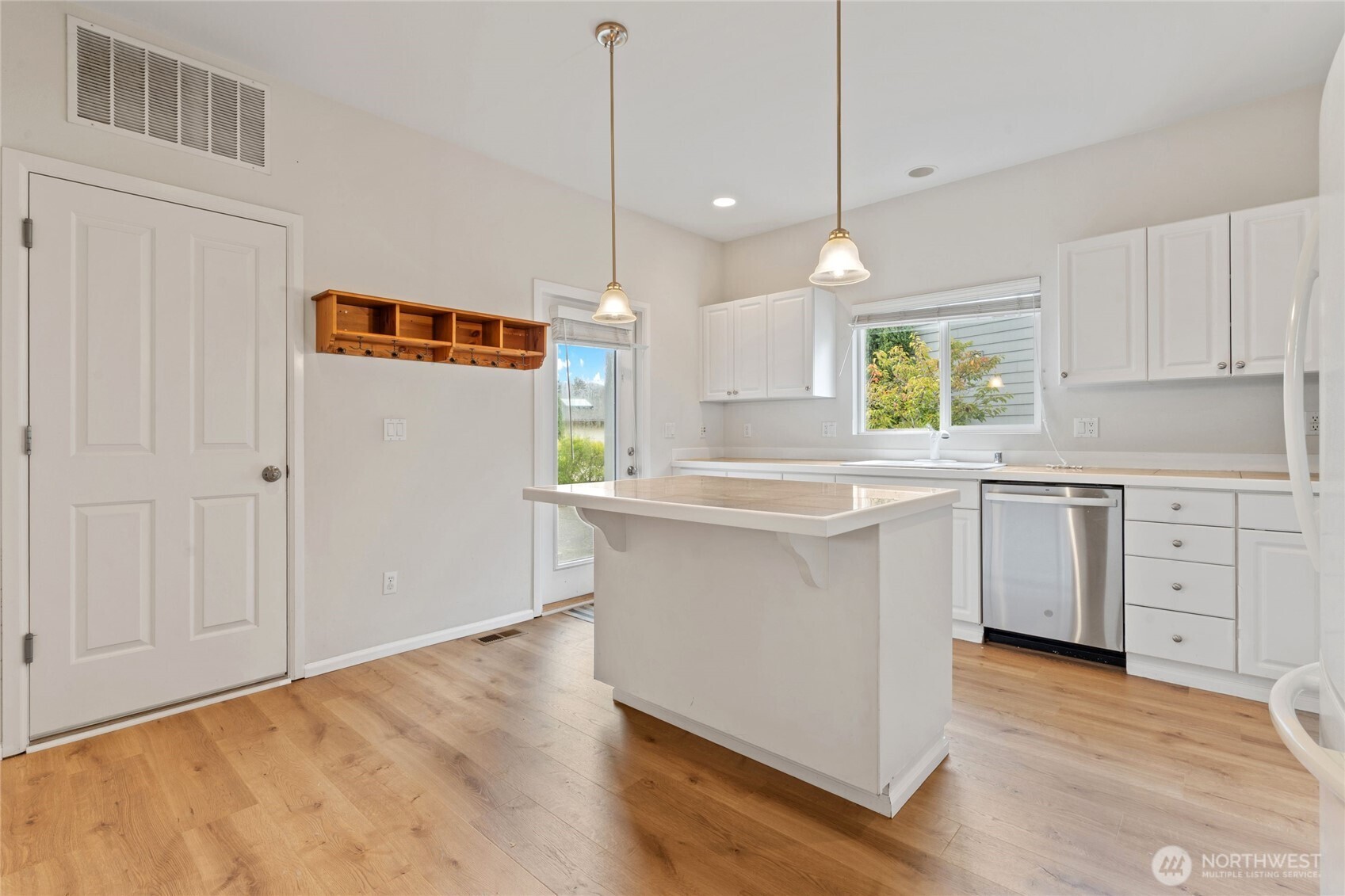 16919 165th Place Southeast Renton, WA 98058 - Photo 10 of 29 a kitchen with white cabinets and sink