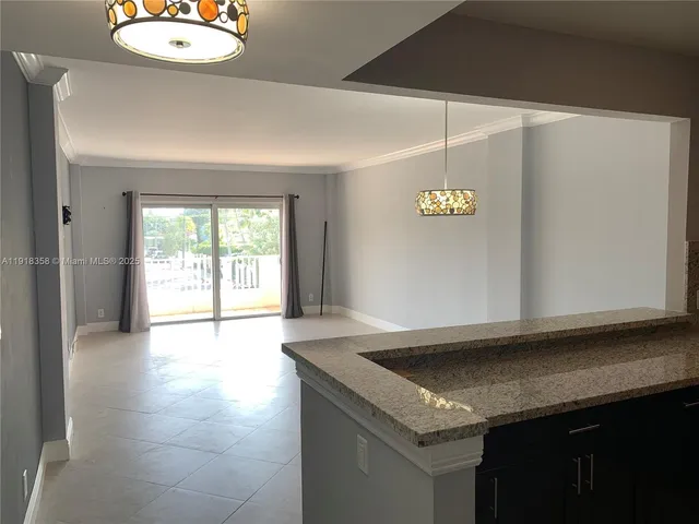 a kitchen with a sink dishwasher and a refrigerator