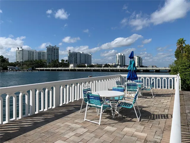 a view of a chairs and table on the terrace