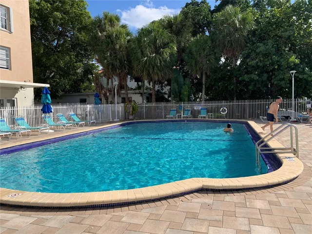 a view of a chairs and table in the balcony