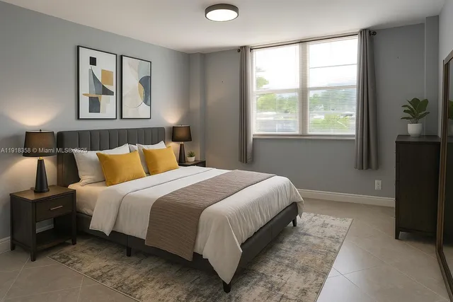 a bedroom with bed and window