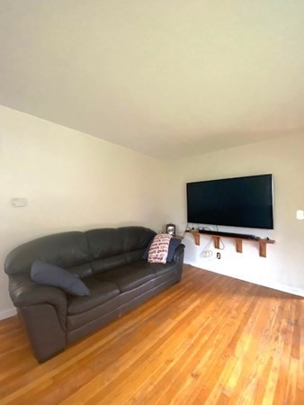 219 Clark Street Gardner, MA 01440 - Photo 17 of 29 a living room with furniture and a flat screen tv