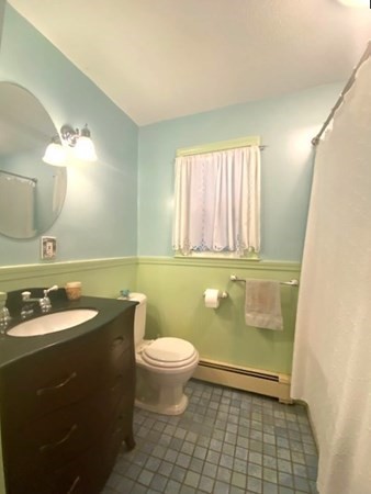 219 Clark Street Gardner, MA 01440 - Photo 18 of 29 a bathroom with a granite countertop sink a toilet and a mirror