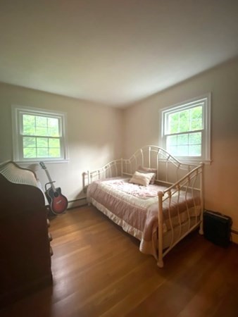 219 Clark Street Gardner, MA 01440 - Photo 19 of 29 a bed sitting in a bedroom next to a window