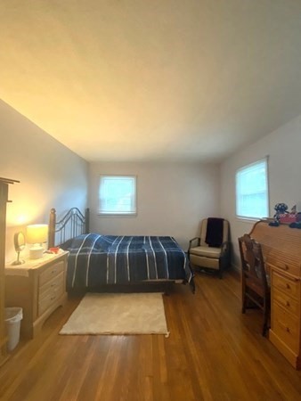 219 Clark Street Gardner, MA 01440 - Photo 20 of 29 a bedroom with a bed and wooden floor