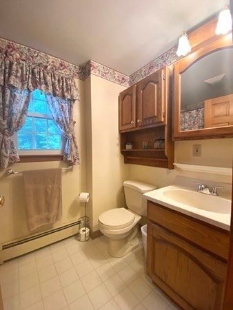 219 Clark Street Gardner, MA 01440 - Photo 25 of 29 a bathroom with a sink a toilet and shower