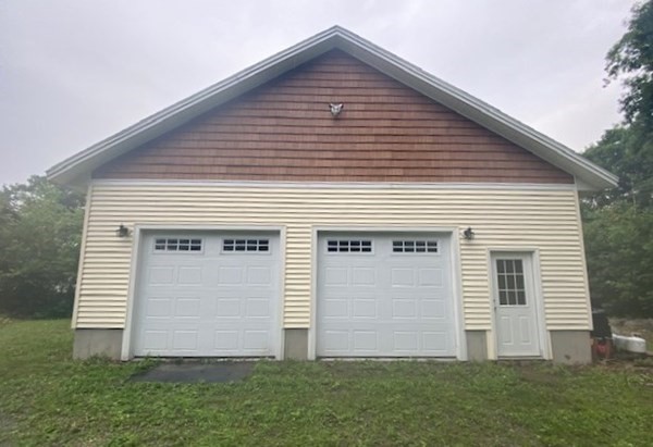 219 Clark Street Gardner, MA 01440 - Photo 28 of 29 a front view of house with garden