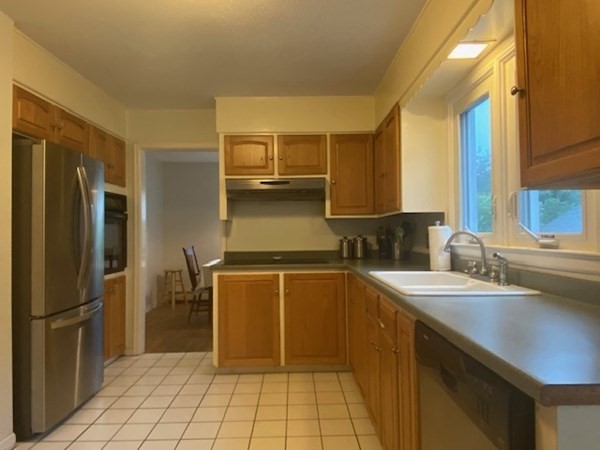 219 Clark Street Gardner, MA 01440 - Photo 8 of 29 a kitchen with a sink refrigerator and cabinets