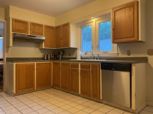 219 Clark Street Gardner, MA 01440 - Photo 9 of 29 a kitchen with stainless steel appliances a sink and cabinets