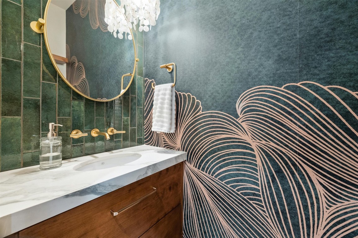 333 Stallion Lane Dripping Springs, TX 78620 - Photo 12 of 40 a bathroom with a sink mirror and vanity