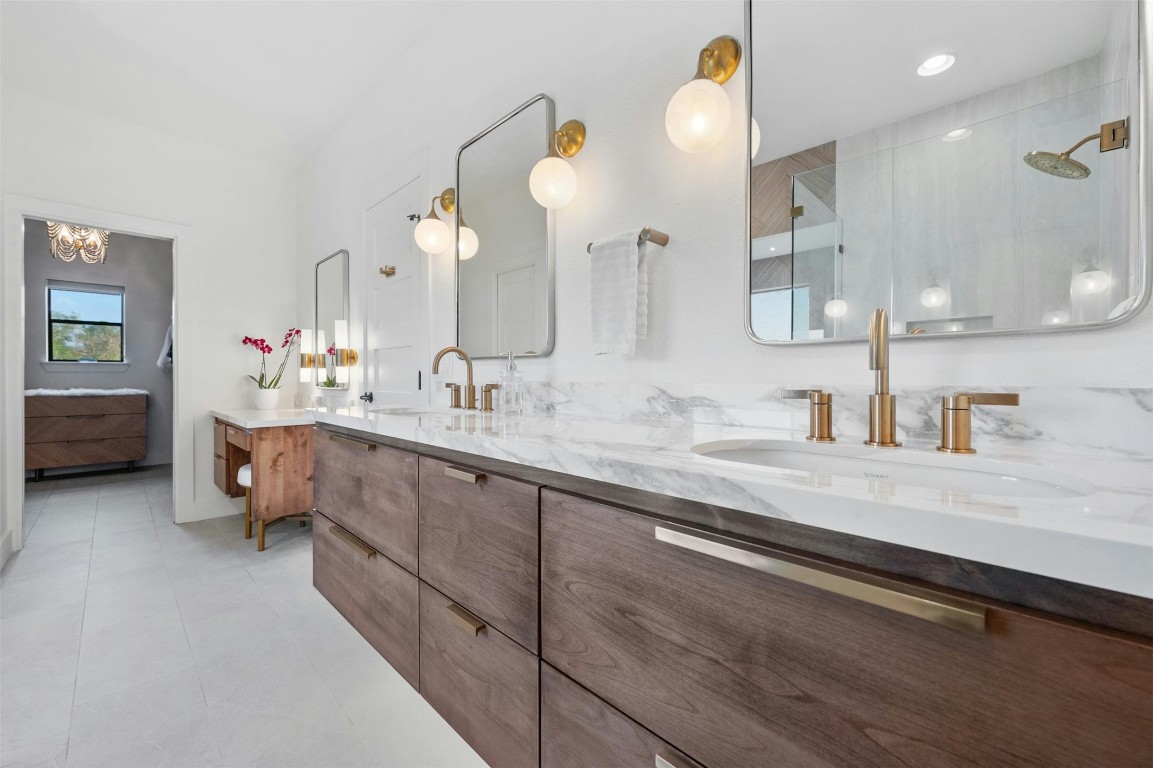 333 Stallion Lane Dripping Springs, TX 78620 - Photo 17 of 40 a bathroom with a sink double vanity and a mirror