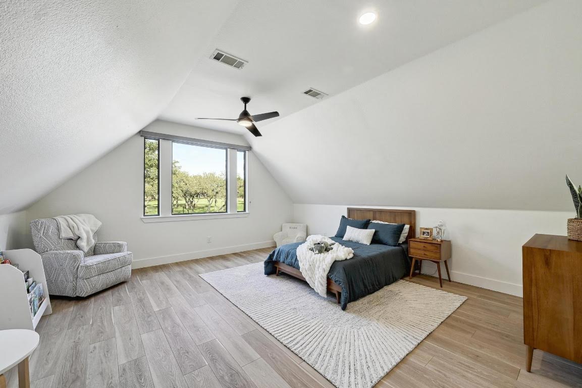 333 Stallion Lane Dripping Springs, TX 78620 - Photo 22 of 40 a living room with furniture and a window